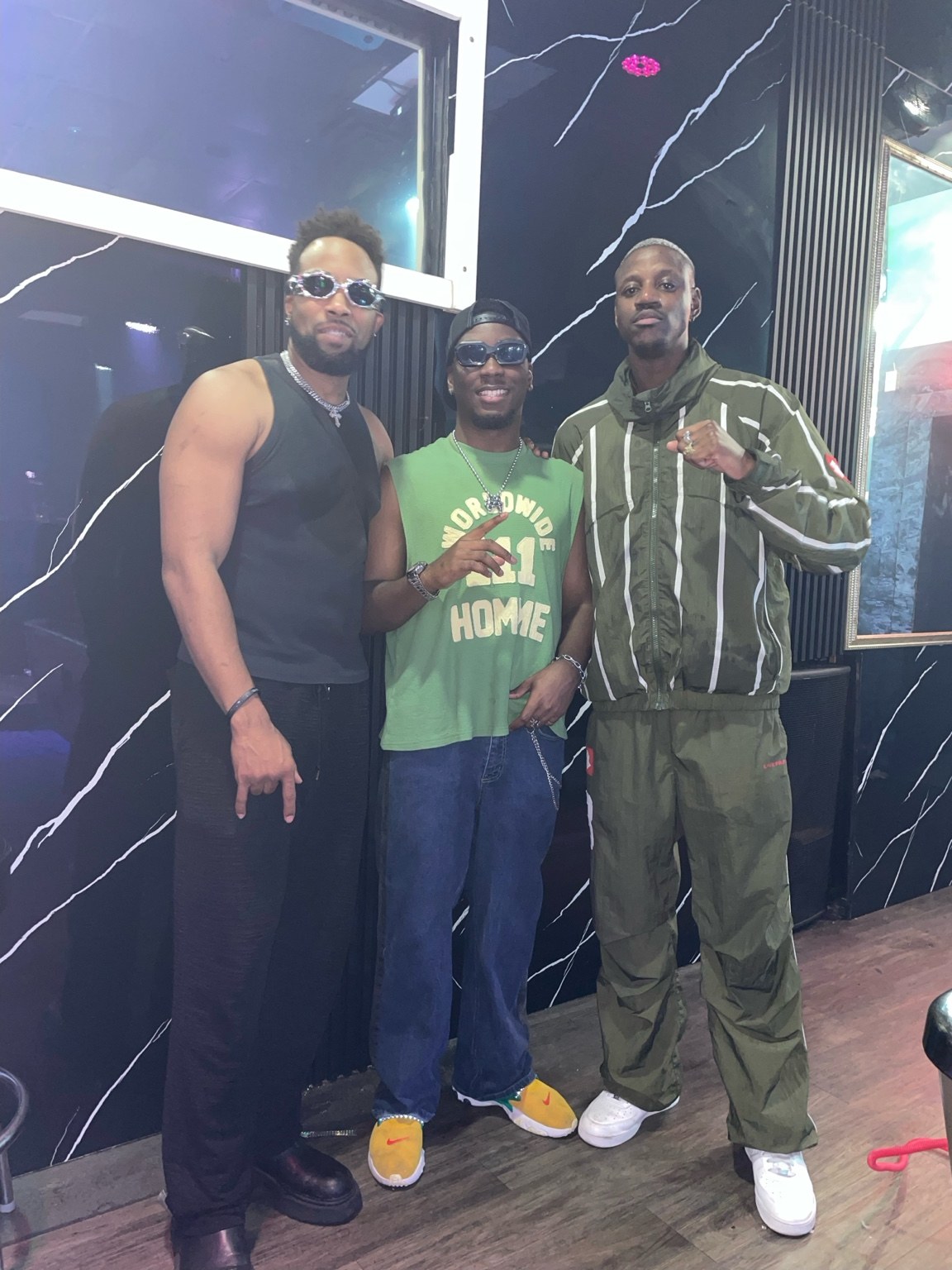 Three guests posing together at the Kilimanjaro event at It’ll Do Club